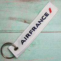 Thumbnail for Air France aviation Remove Before Flight key chain, aviation-tag style webbing.