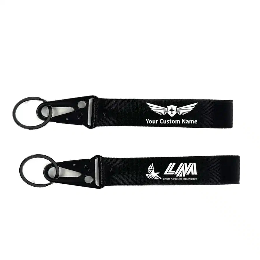 Mozambique Airlines aviation hawk-shaped key chain, durable metal alloy.