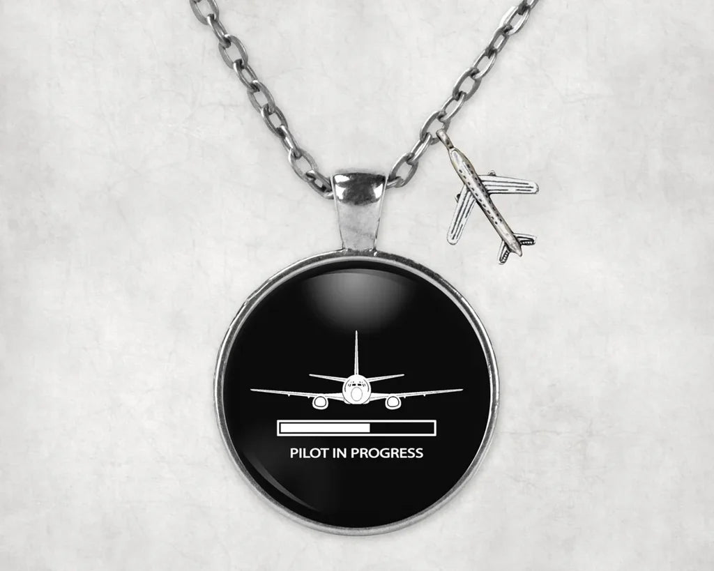 Side view of Pilot In Progress aviation necklace in stainless steel, polished finish.