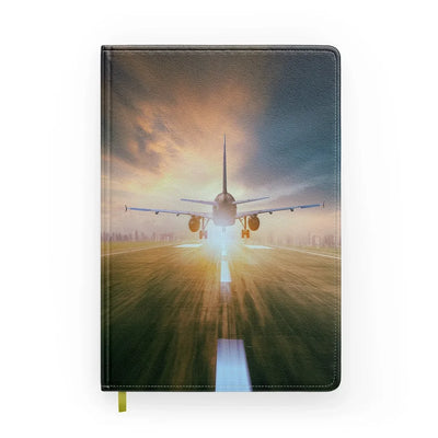 Airplane Flying Over Runway aviation design on premium hardcover notebook.