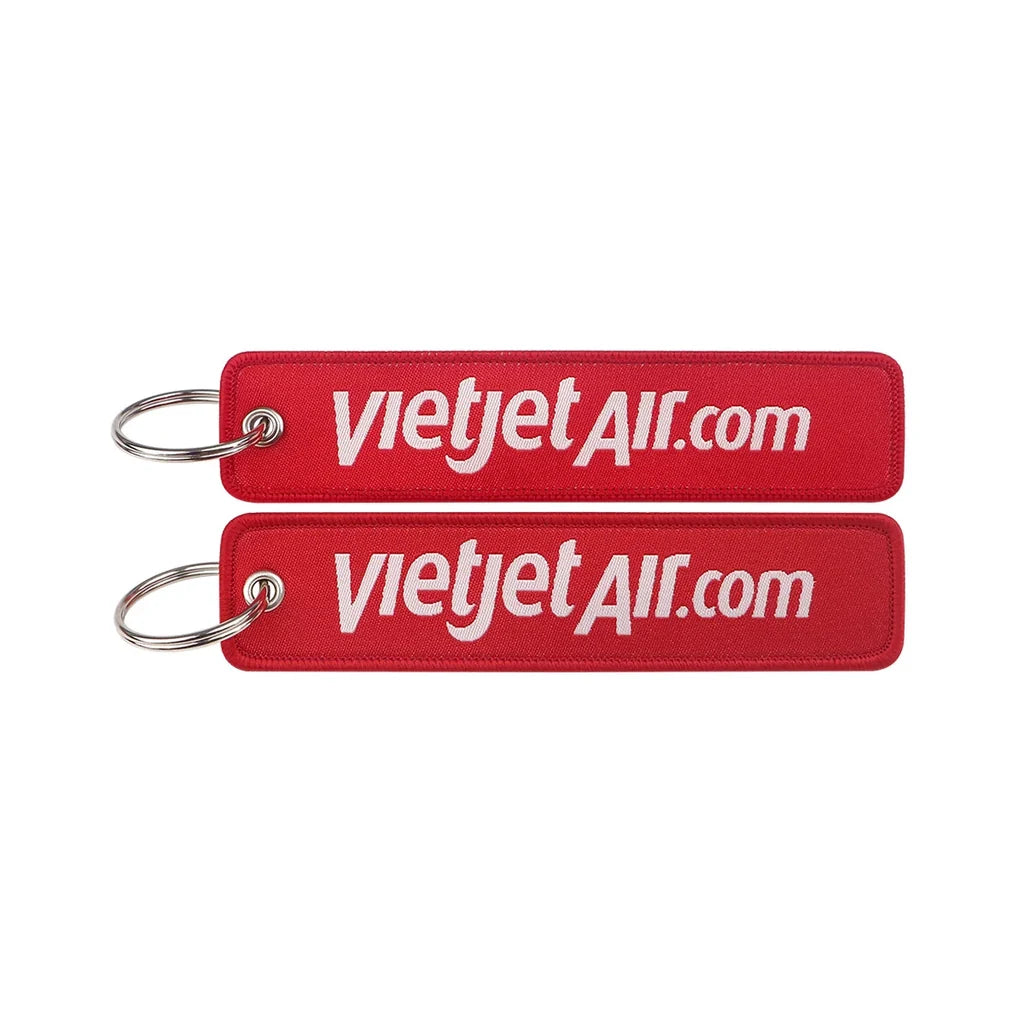 VietJet Air (Red) aviation Remove Before Flight key chain, aviation-tag style webbing.