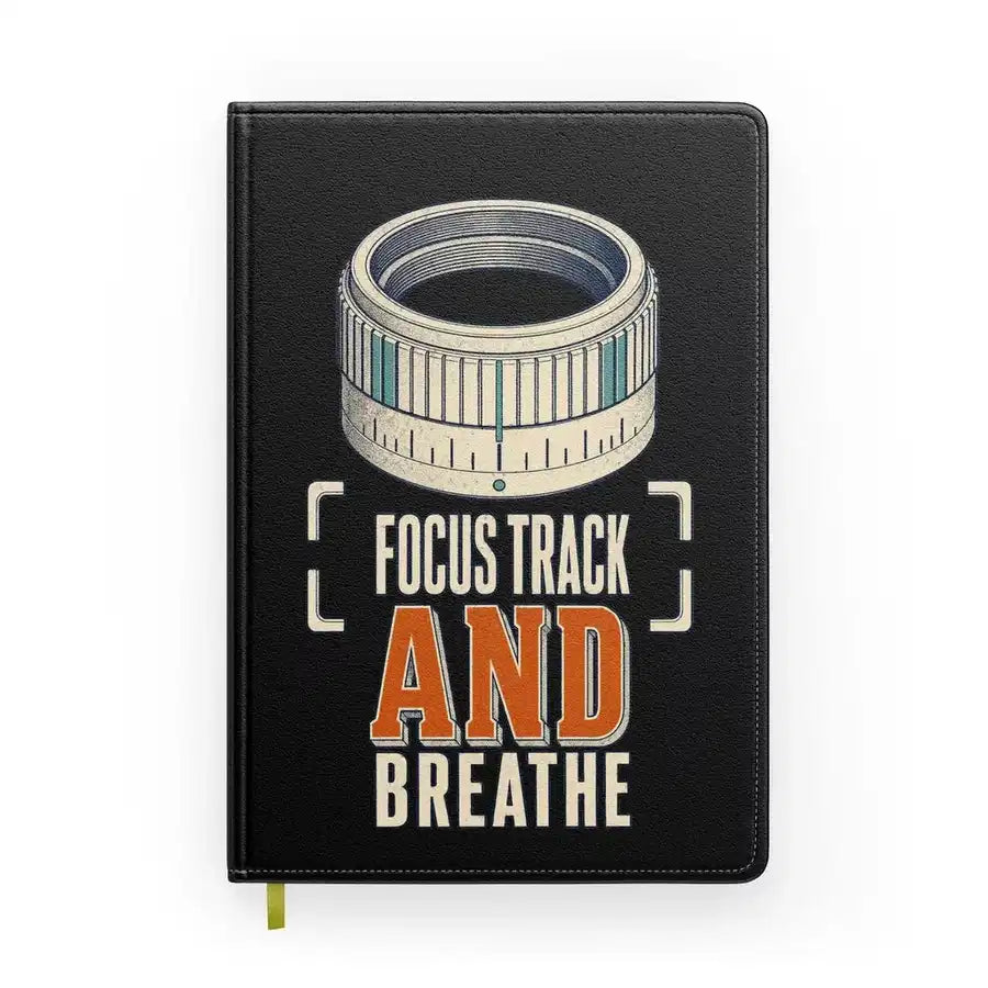 Focus Track And Breathe design on black notebook
