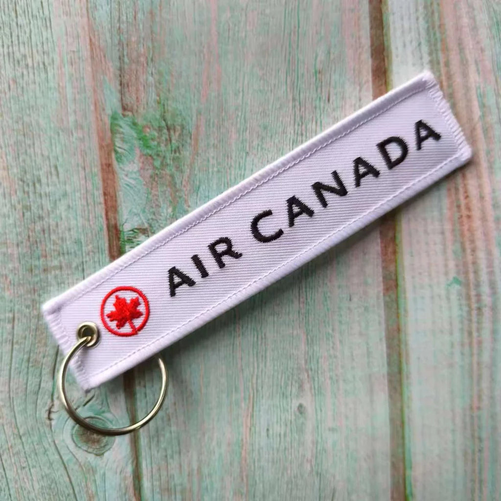 Air Canada aviation Remove Before Flight key chain, aviation-tag style webbing.