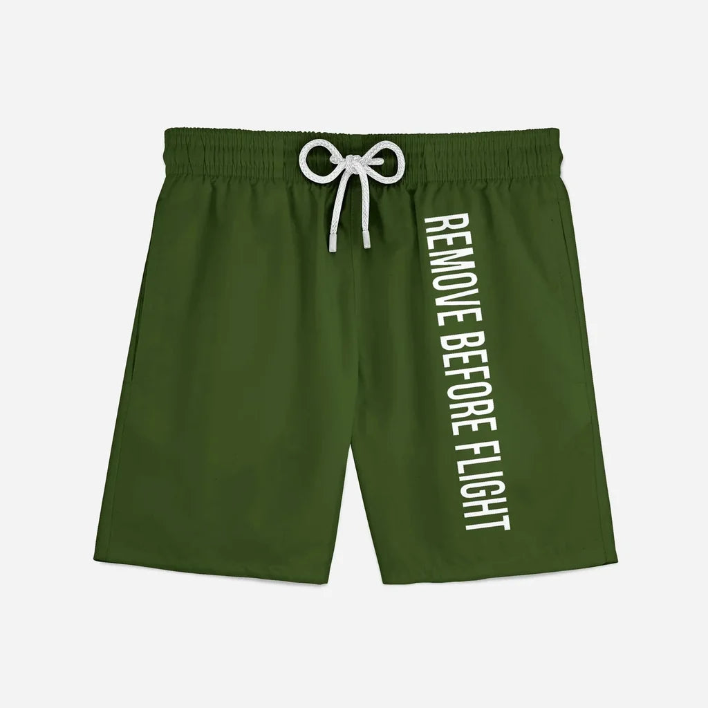 Remove Before Flight 2 (Green) aviation design on quick-dry polyester swim trunks.