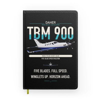 Daher TBM 900 design on black notebook