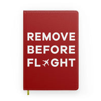 Thumbnail for Remove Before Flight aviation design on premium hardcover notebook.