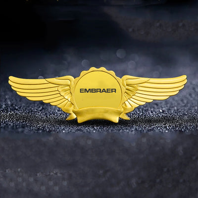 Embraer & Text aviation badge in polished metal.