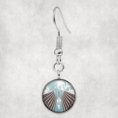 Airplane Flying over Big Buildings aviation-themed earrings, polished hypoallergenic alloy.