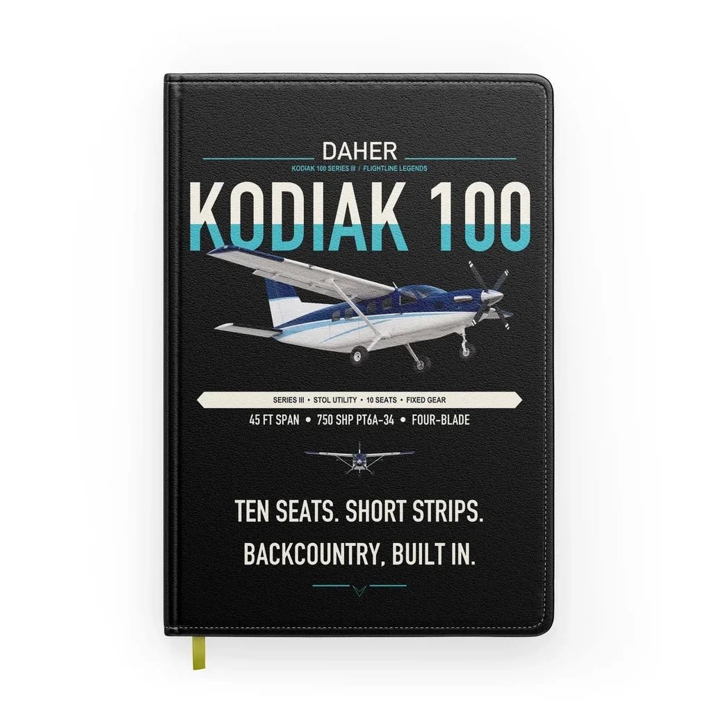 Daher Kodiak 100 Series III design on black notebook