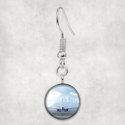 Side view of Boeing 737 & City View Behind aviation earrings in hypoallergenic alloy, polished finish.