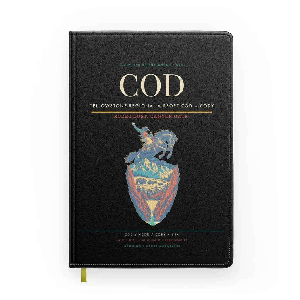 Yellowstone Regional Airport (COD) design on black notebook