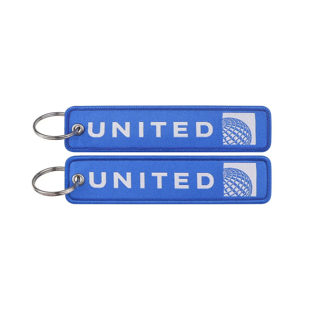 United Airlines (2) aviation Remove Before Flight key chain, aviation-tag style webbing.