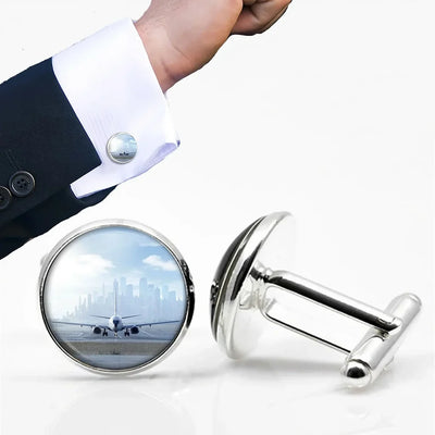 Boeing 737 & City View Behind aviation-themed cuff links, polished metal.