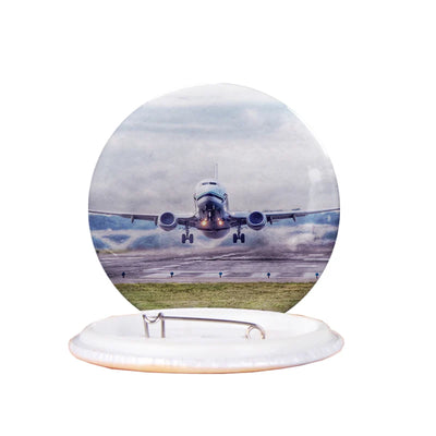 Departing Boeing 737 aviation design pin in polished enamel.