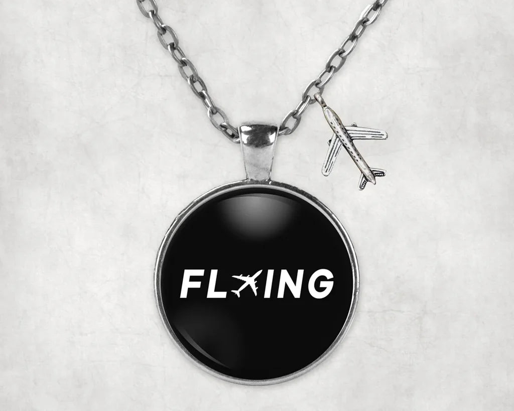 Flying aviation necklace, stainless steel body with engraved detail.
