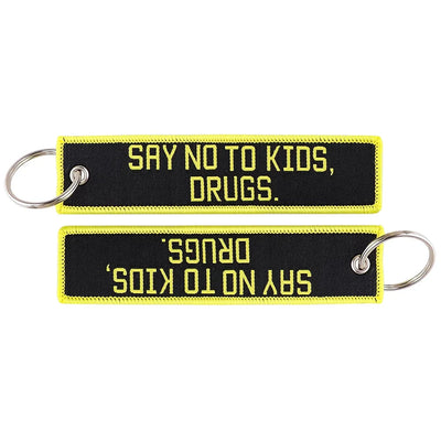 SRY NO TO KIDS DRUGS. aviation fashion key chain in polished metal.