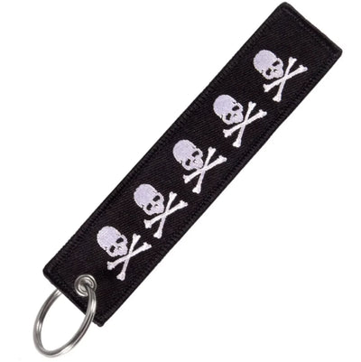 Many Skulls aviation fashion key chain in polished metal.