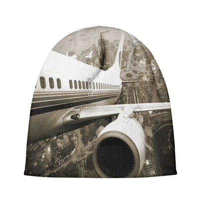 Departing Aircraft & City Scene behind aviation embroidery on soft knit fabric 3D knit beanie.