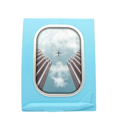 Airplane Flying over Big Buildings aviation design on durable resin with glass face airplane window photo frame.