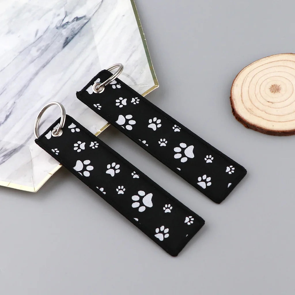 Paw Print Fun aviation fashion key chain in polished metal.