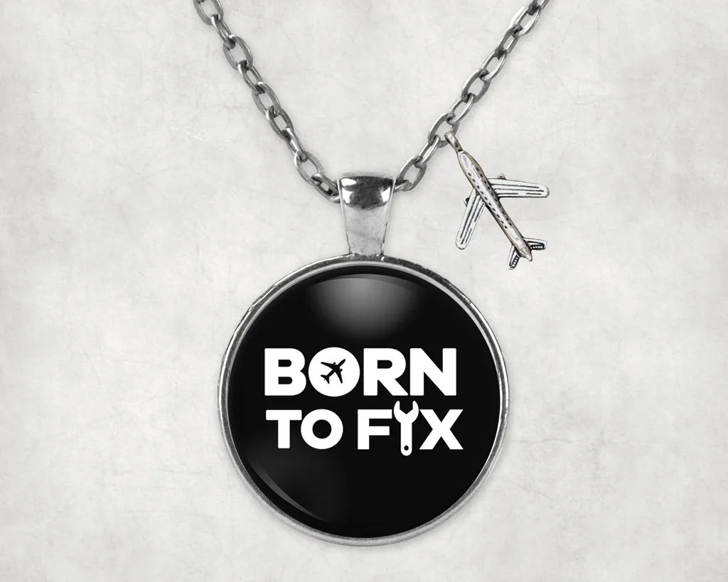 Side view of Born To Fix Airplanes aviation necklace in stainless steel, polished finish.