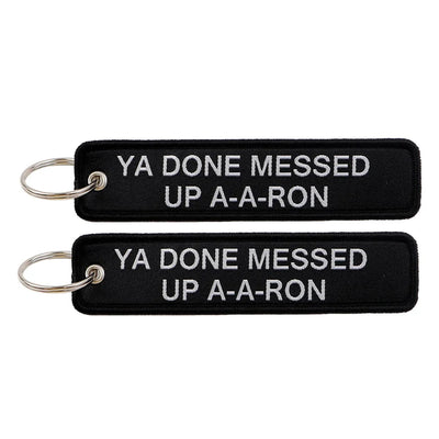 YA DONE MESSED UP A-A-RON aviation fashion key chain in polished metal.