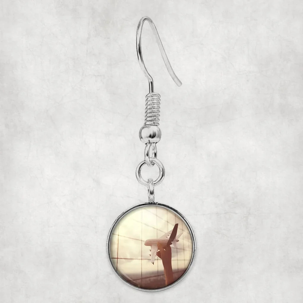Side view of Follow Your Dreams aviation earrings in hypoallergenic alloy, polished finish.