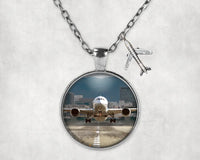 Thumbnail for Departing Boeing 787 Dreamliner aviation necklace, stainless steel body with engraved detail.