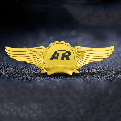 ATR & Text aviation badge in polished metal.