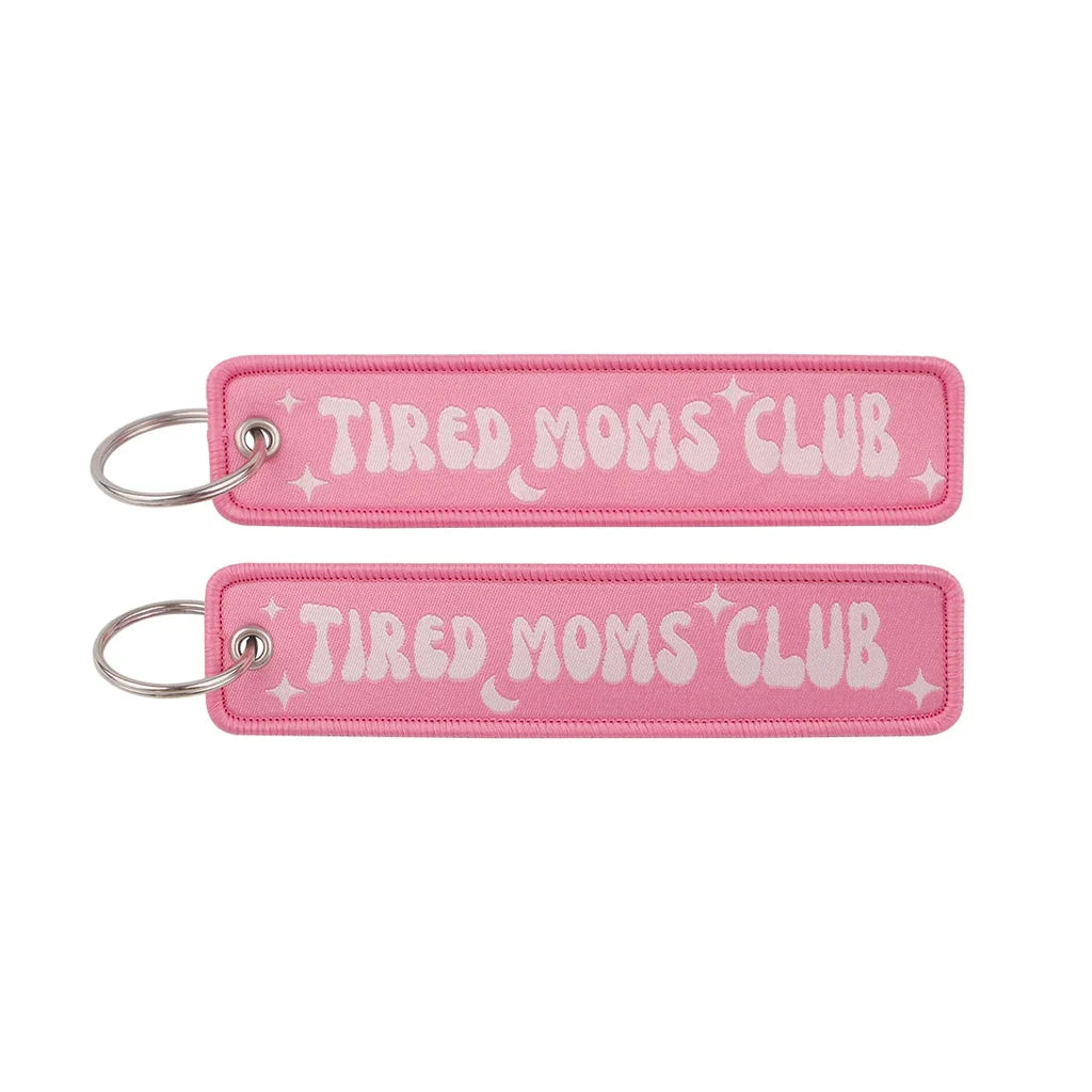 TIRED MOMS CLUB aviation fashion key chain in polished metal.