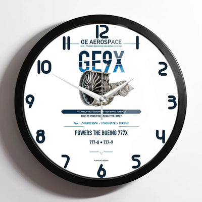 GE9X design on white framed wall clock