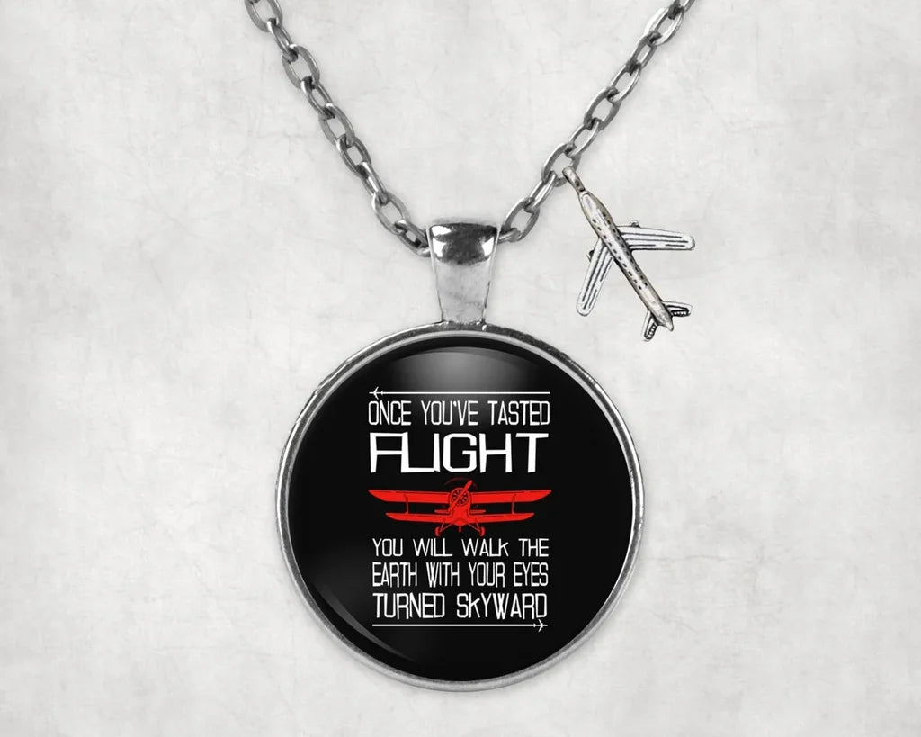Side view of Once You've Tasted Flight aviation necklace in stainless steel, polished finish.