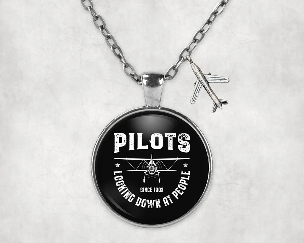 Pilots Looking Down at People Since 1903 aviation necklace, stainless steel body with engraved detail.