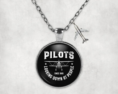 Pilots Looking Down at People Since 1903 aviation necklace, stainless steel body with engraved detail.
