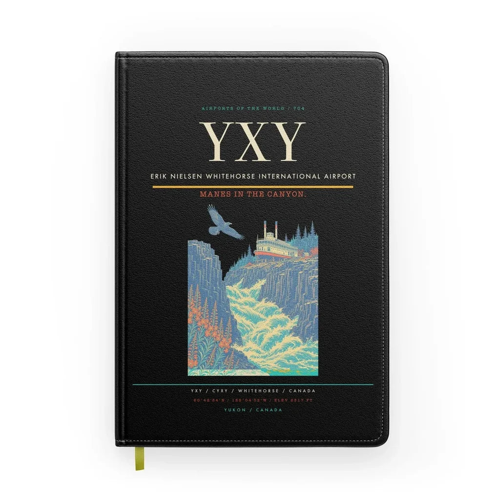 Erik Nielsen Whitehorse International Airport (YXY) design on black notebook