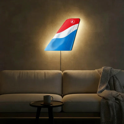 Luxair aviation design on durable metal with LED aircraft tail wall art.