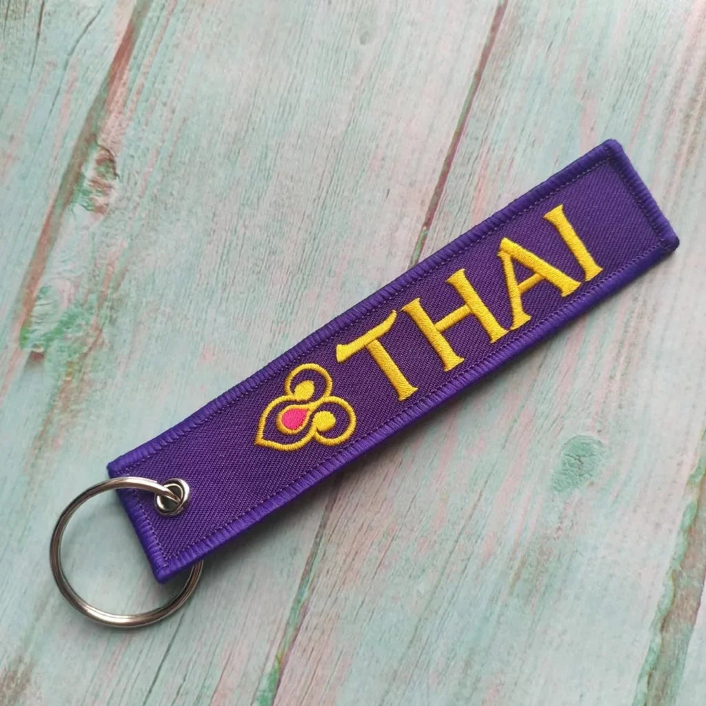 Thai Airways aviation Remove Before Flight key chain, aviation-tag style webbing.