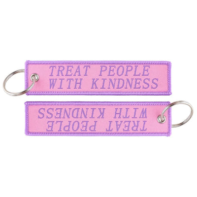 TREAT PEOPLE WITH KINDNESS. aviation fashion key chain in polished metal.
