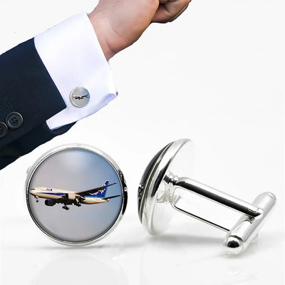 ANA's Boeing 777 aviation-themed cuff links, polished metal.
