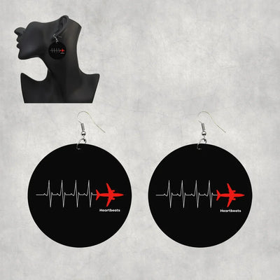 Aviation Heartbeats aviation-themed drop earrings, polished wood with metal hooks.