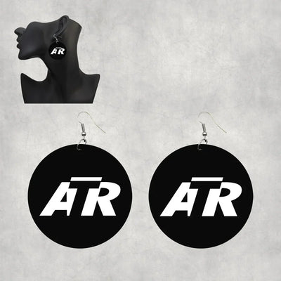 ATR & Text aviation-themed drop earrings, polished wood with metal hooks.
