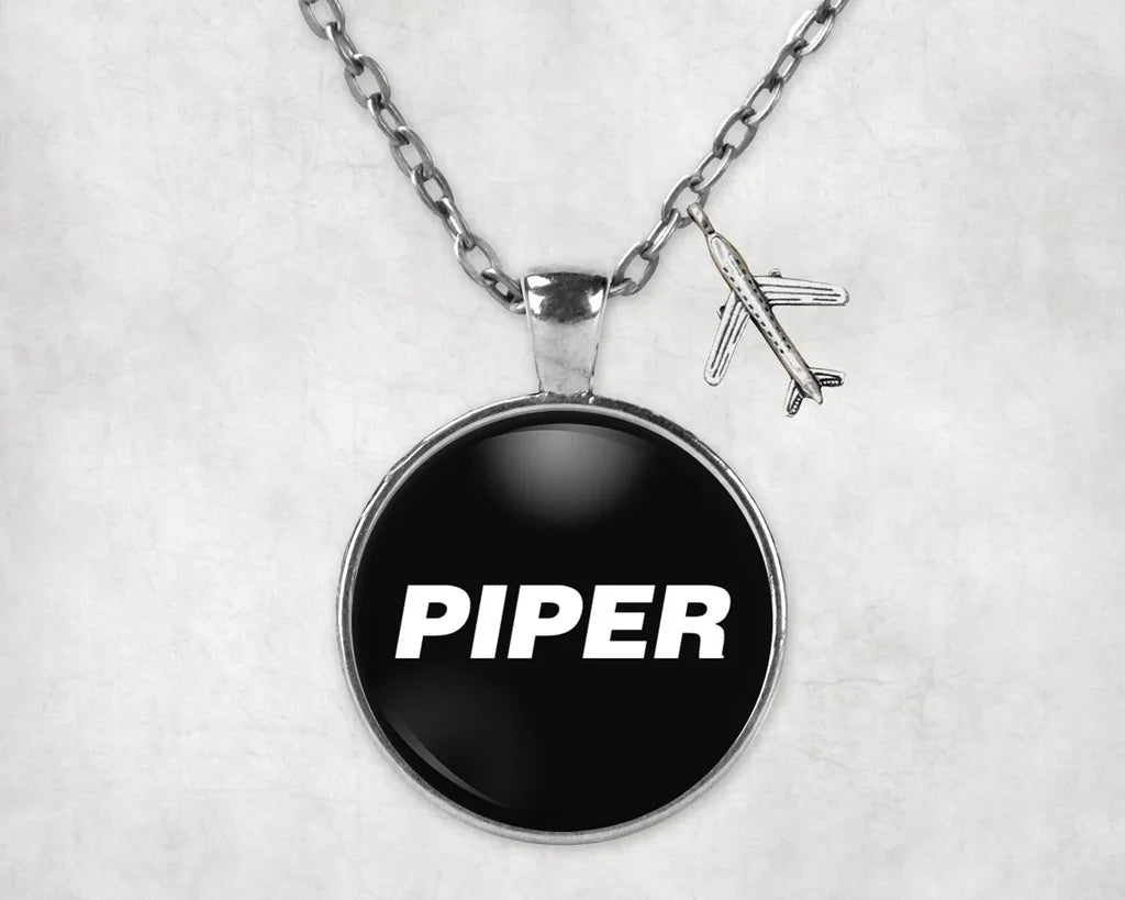 Side view of Piper & Text aviation necklace in stainless steel, polished finish.