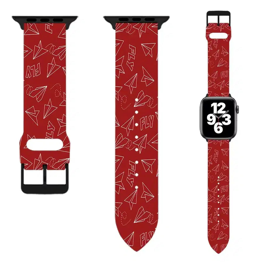 Side view of Paper Airplane & Fly (Red) aviation Apple Watch band in soft silicone, polished finish.