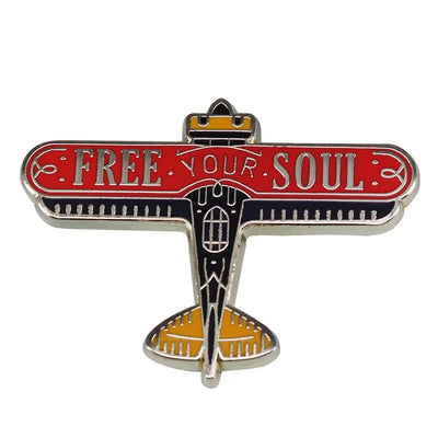 Free Your Soul aviation design on polished metal badge.