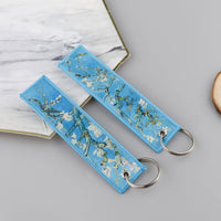 Thumbnail for Almond Blossoms aviation fashion key chain in polished metal.
