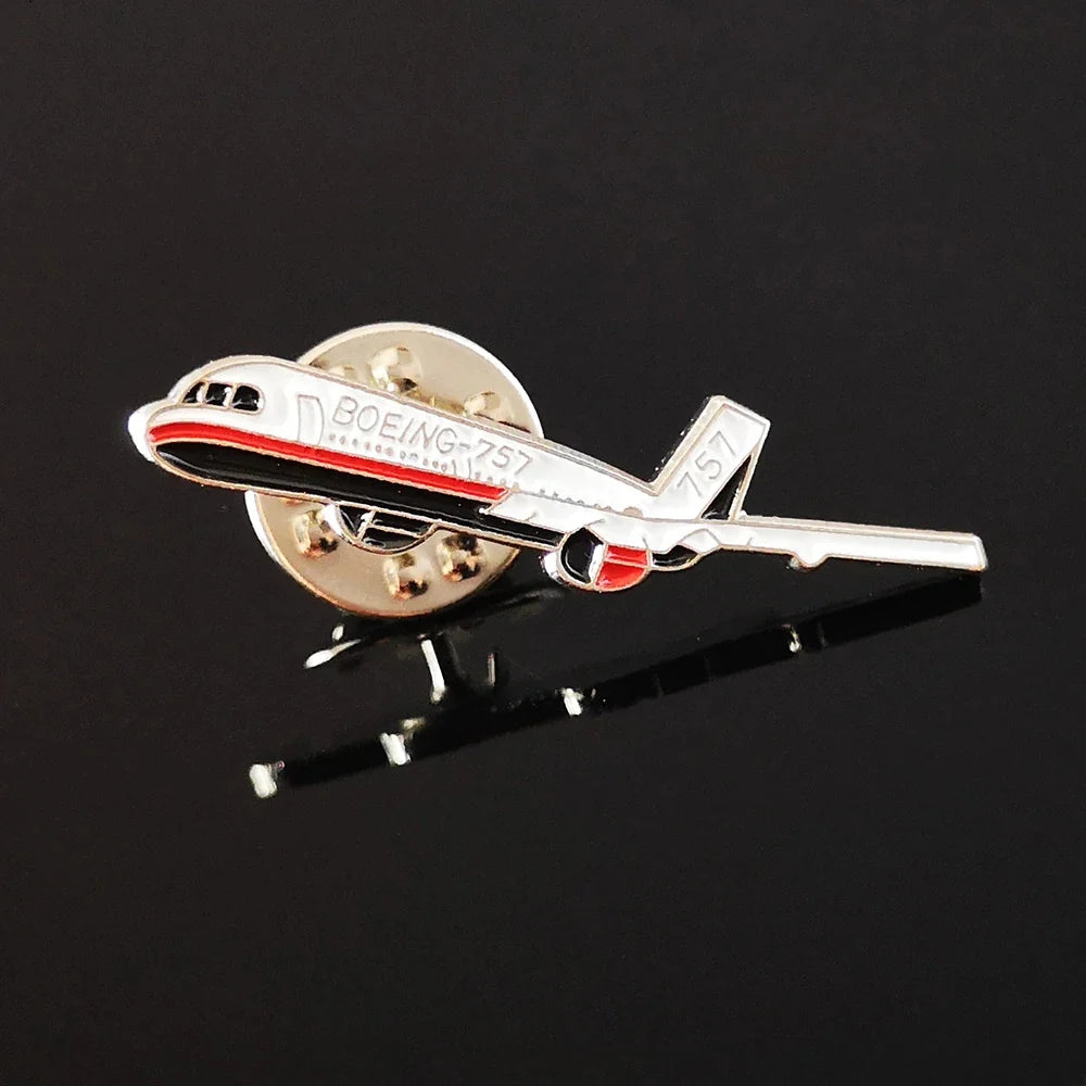 Boeing 757 aviation design on polished metal badge.