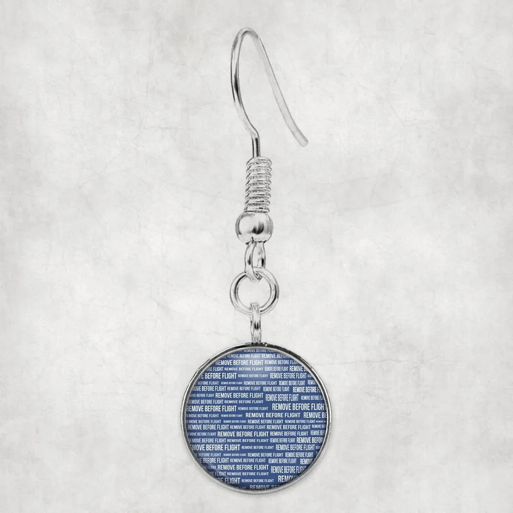 Side view of Remove Before Flight 3Blue aviation earrings in hypoallergenic alloy, polished finish.