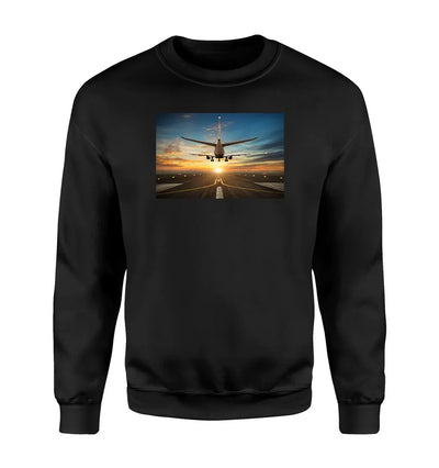 Airplane over Runway Towards the Sunrise aviation design printed on soft cotton blend sweatshirt.