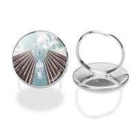 Thumbnail for Airplane Flying over Big Buildings aviation ring in stainless steel.
