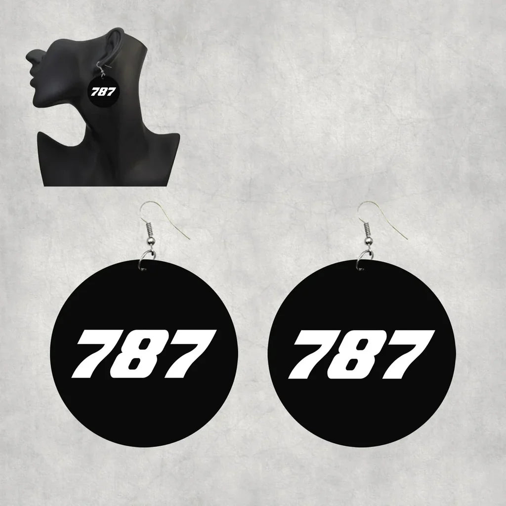 Side view of Boeing 787 Flat Text aviation drop earrings in wood with metal hooks, polished finish.